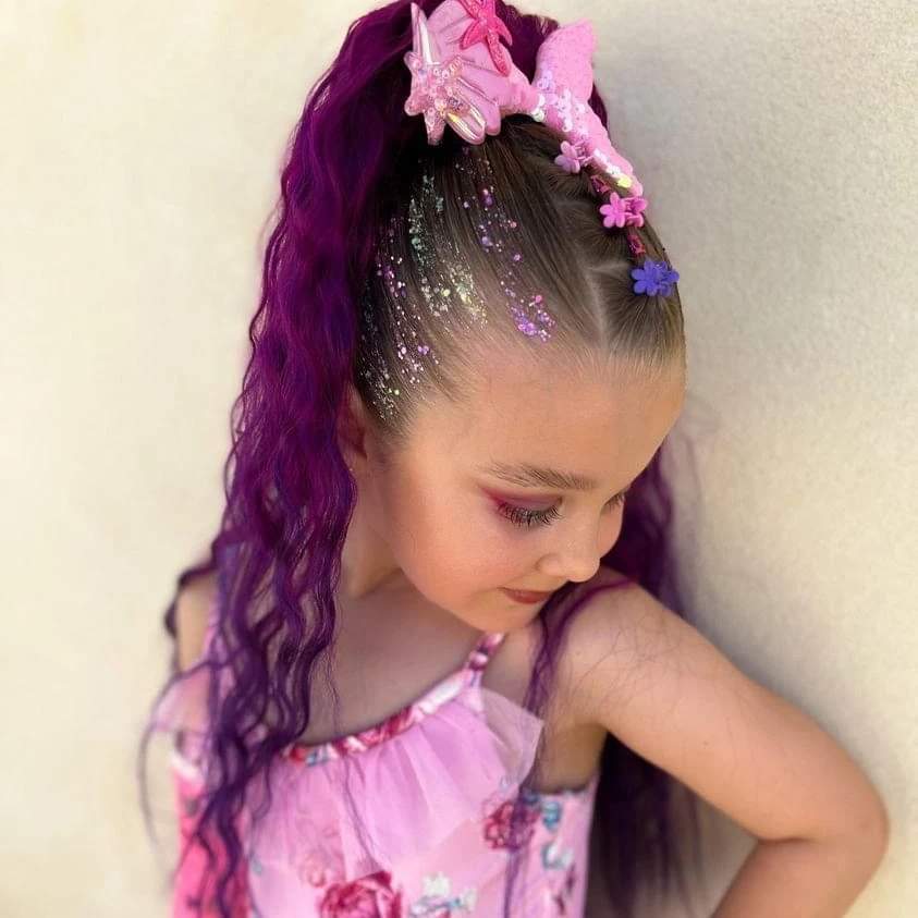 The original premium reusable purple wavy princess hair extensions for kids by Mermaid Hair By Emma, perfect for Disney dress-up and fairytale costume parties.