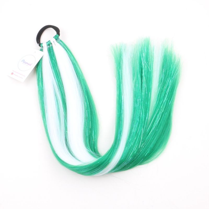 A set of green tie-in hair extensions with tinsel, attached to a hair tie, displayed on a white background.