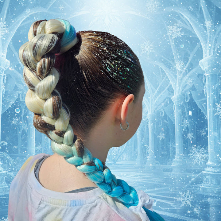 Person with colorful braided hair at an outdoor event with a sign in the background.