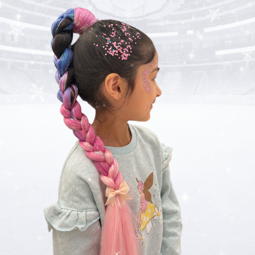 Child with colorful braided hair and face paint on a white background
