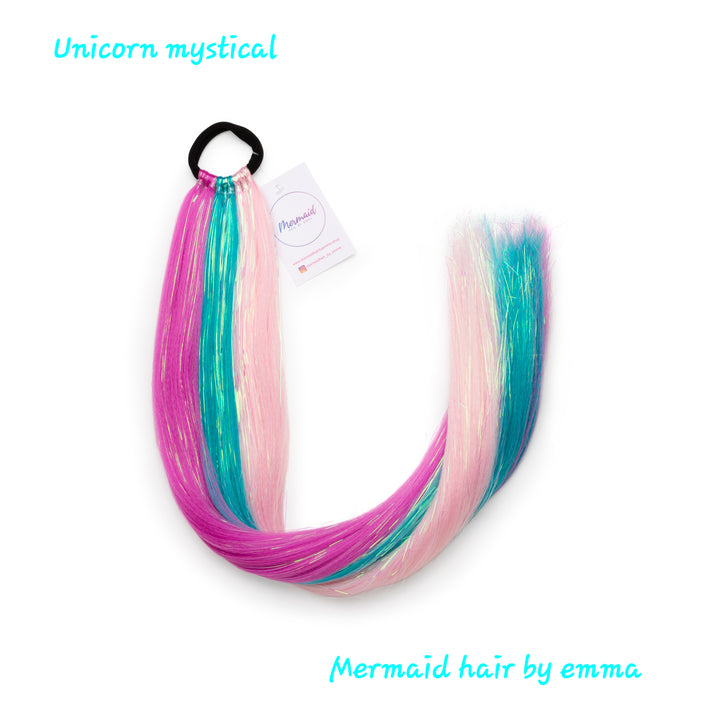 A set of multicolored mermaid hair extensions with tinsel, tied together with an elastic band, featuring colors such as pink, purple, and blue.