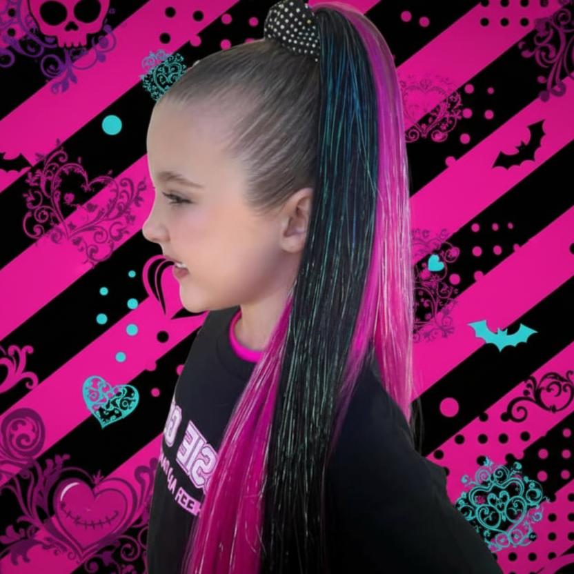 Person with pink and black hair extensions against a colorful patterned background