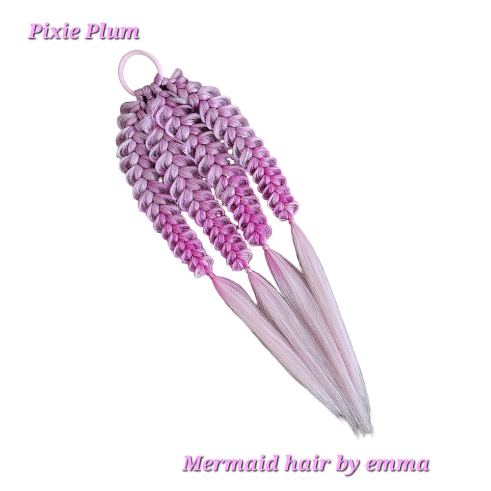 Pink mermaid hair extensions with a white background