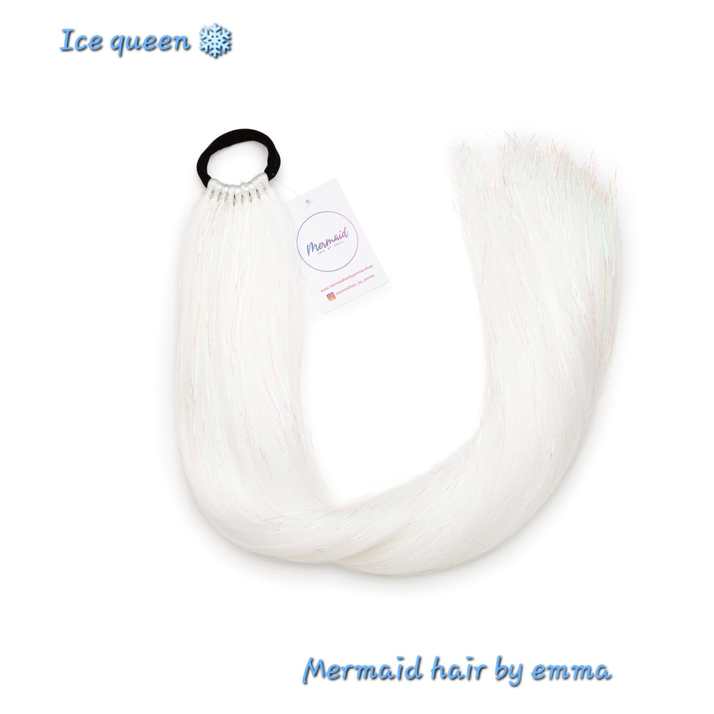 White synthetic mermaid hair extensions with an attached hair tie, packaged with a label showing the brand name 'Ice queen' and the product name 'Mermaid hair by emma'.