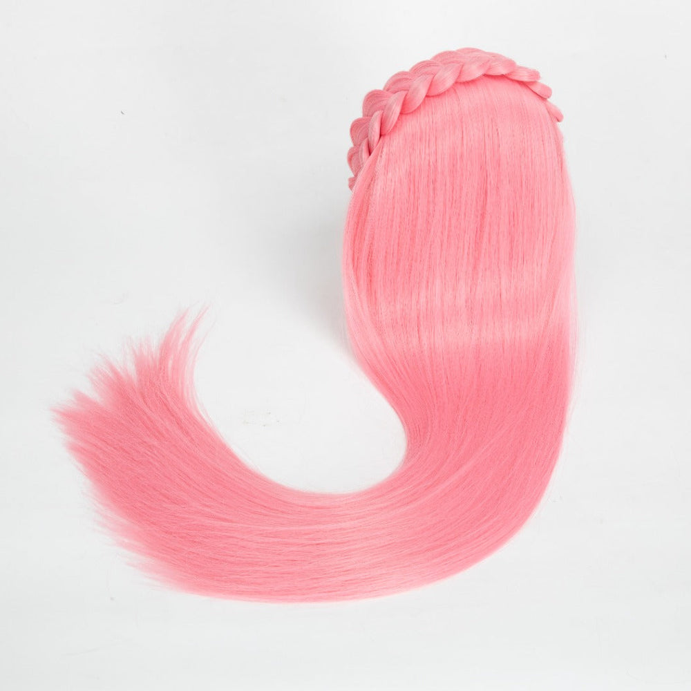Pink hair extension with a clip on a white background